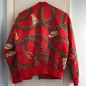 Red Nike gold chain puffer jacket
